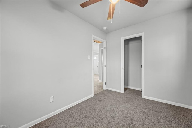 unfurnished bedroom with ceiling fan and carpet