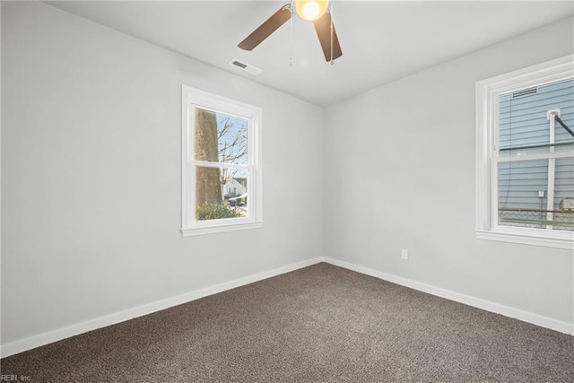 empty room featuring carpet floors and ceiling fan