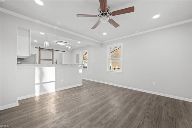 unfurnished living room with ornamental molding, dark hardwood / wood-style floors, and ceiling fan