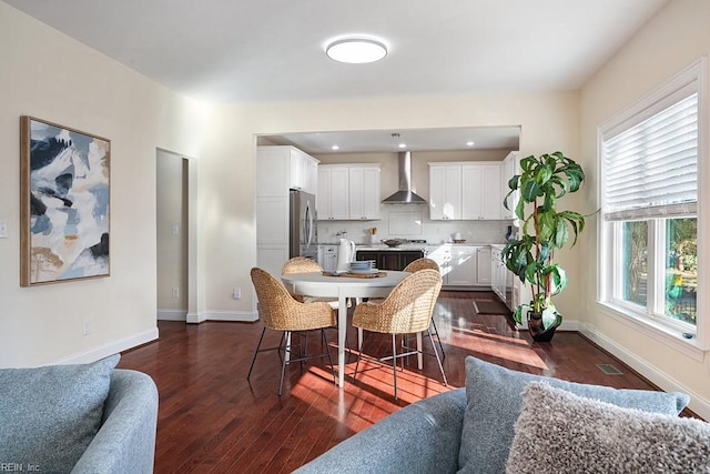 dining room with dark hardwood / wood-style flooring