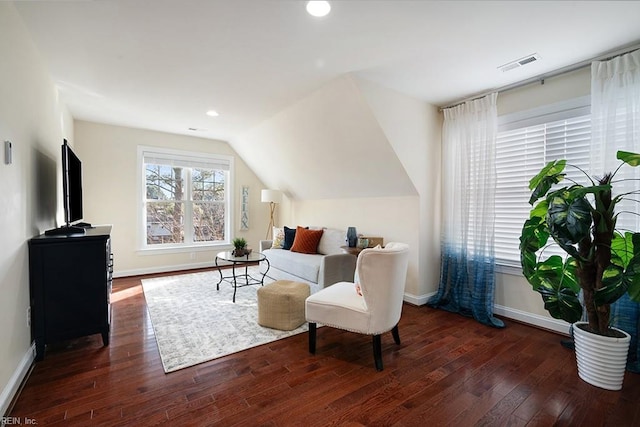 sitting room with dark hardwood / wood-style floors and vaulted ceiling