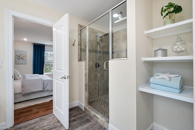 bathroom featuring hardwood / wood-style floors and an enclosed shower