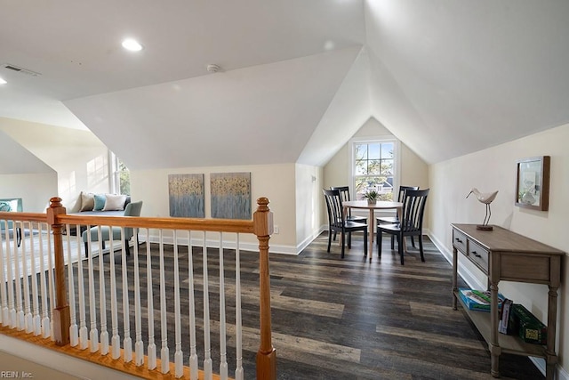 interior space with lofted ceiling and dark hardwood / wood-style floors