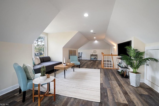 interior space featuring dark hardwood / wood-style flooring and vaulted ceiling