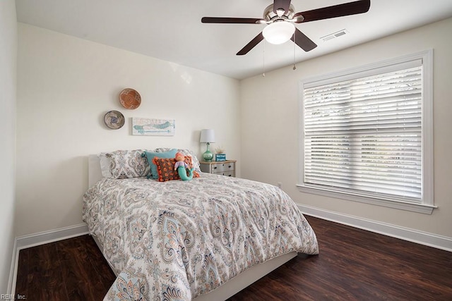 bedroom featuring dark wood-type flooring and ceiling fan