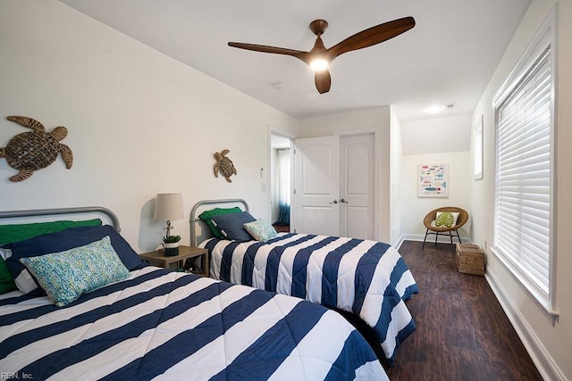 bedroom featuring dark hardwood / wood-style flooring and ceiling fan