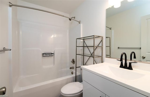 full bathroom featuring bathtub / shower combination, vanity, and toilet