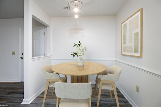 dining space featuring dark hardwood / wood-style floors