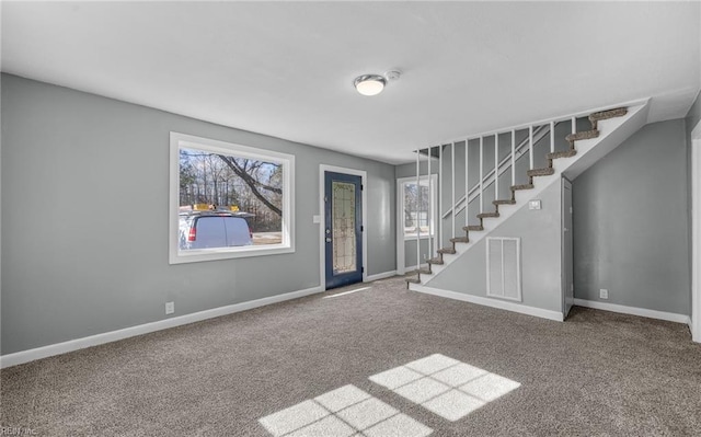 view of carpeted entrance foyer