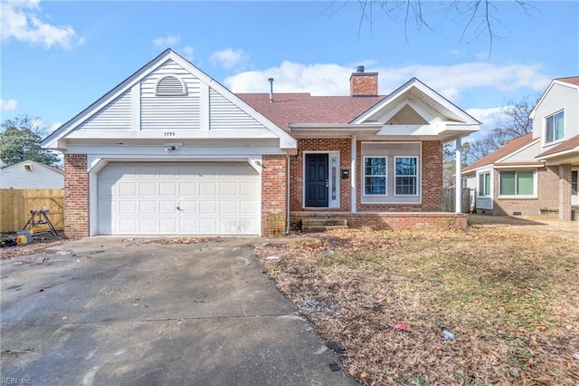 view of front of house with a garage and a front lawn