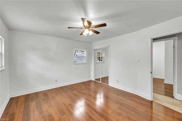 empty room featuring hardwood / wood-style flooring and ceiling fan