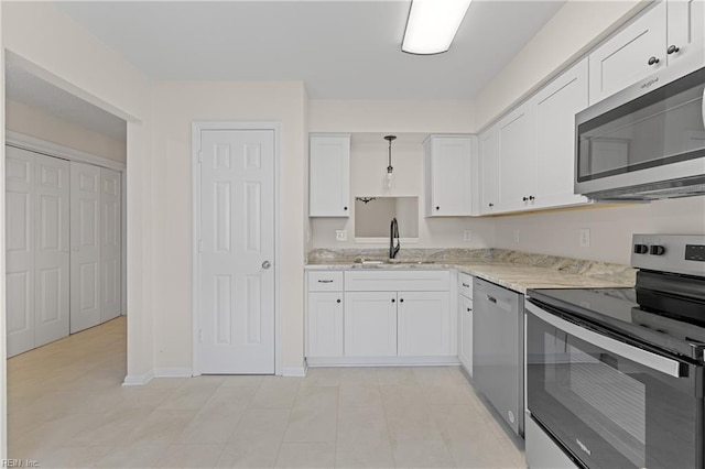 kitchen with stainless steel appliances, white cabinetry, sink, and pendant lighting