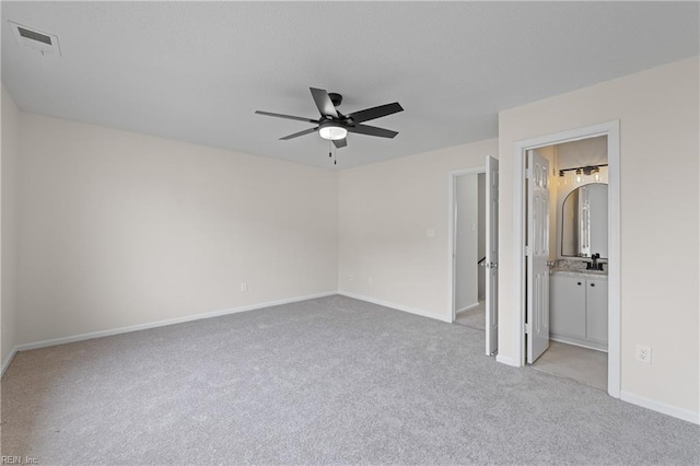 unfurnished bedroom featuring ceiling fan and light carpet