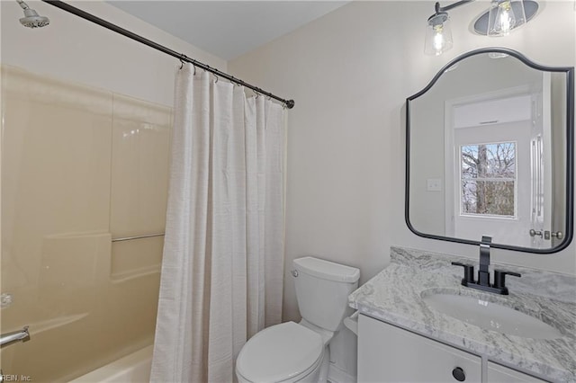 full bathroom with vanity, toilet, and shower / bath combo with shower curtain