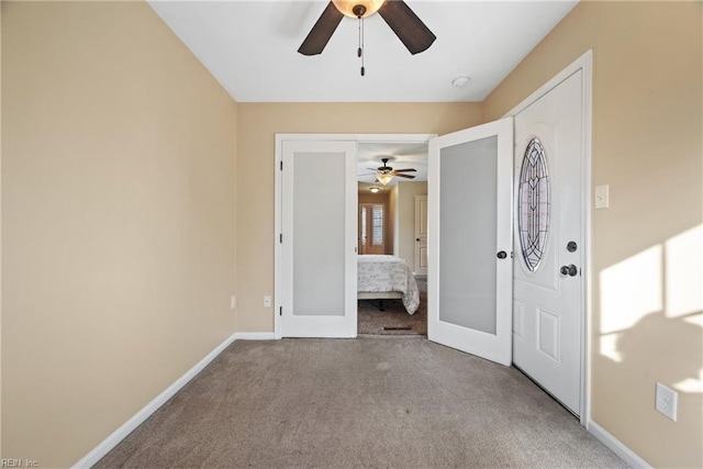 interior space featuring light colored carpet, ceiling fan, and french doors