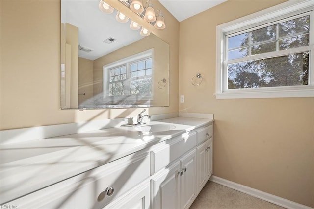 bathroom with tile patterned flooring and vanity