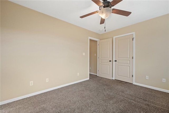 unfurnished bedroom with ceiling fan and carpet