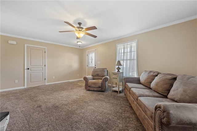 carpeted living room with ornamental molding and ceiling fan