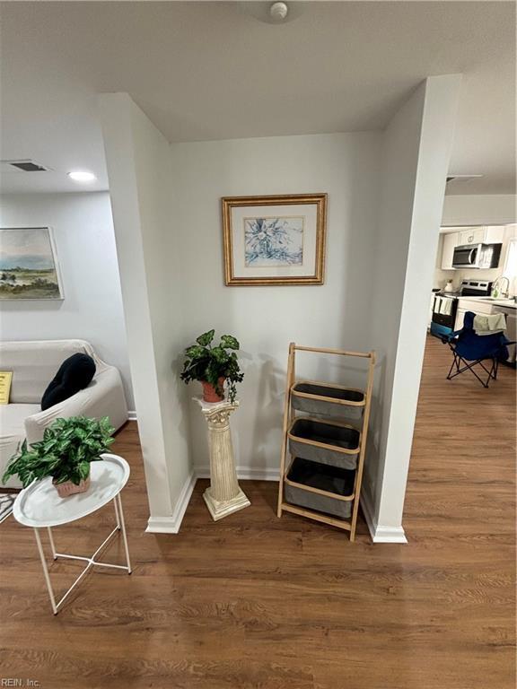 sitting room featuring dark hardwood / wood-style floors