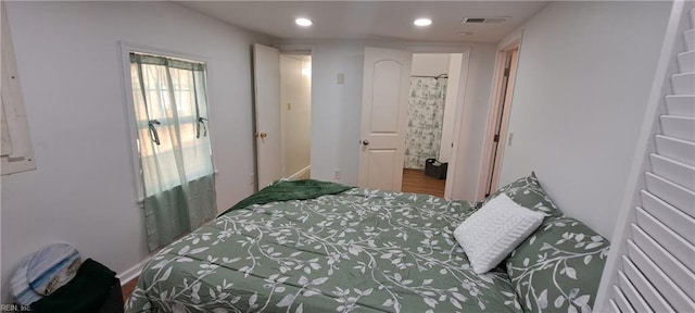 bedroom featuring visible vents, wood finished floors, and recessed lighting