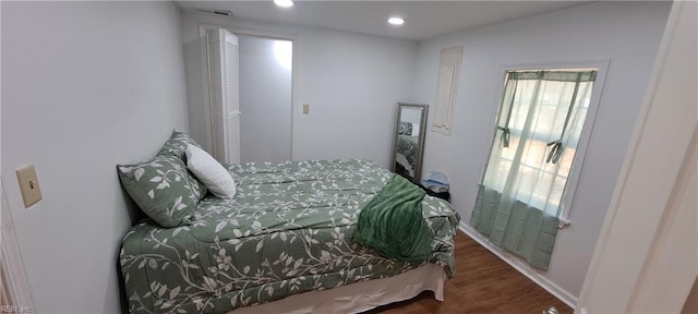 bedroom featuring wood finished floors and recessed lighting