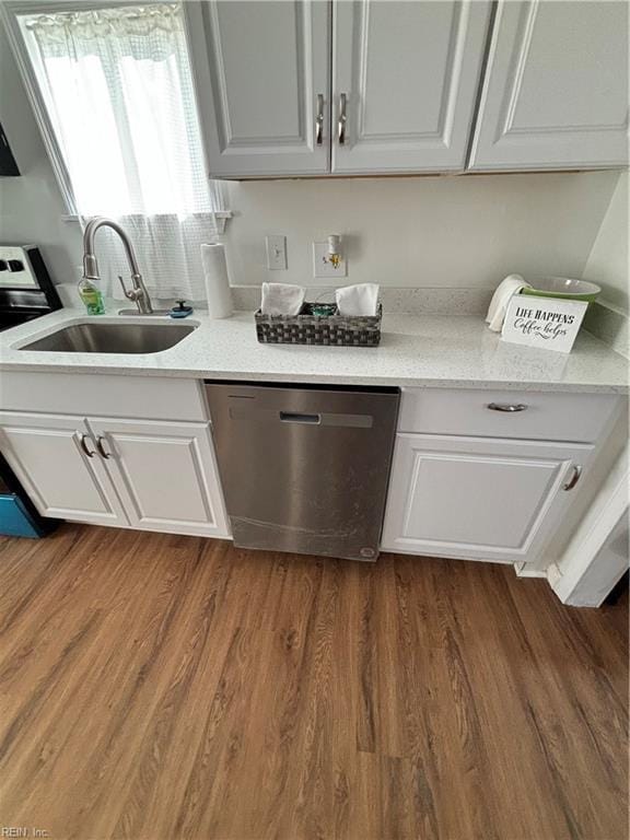 interior space with dark hardwood / wood-style flooring, sink, white cabinets, and appliances with stainless steel finishes