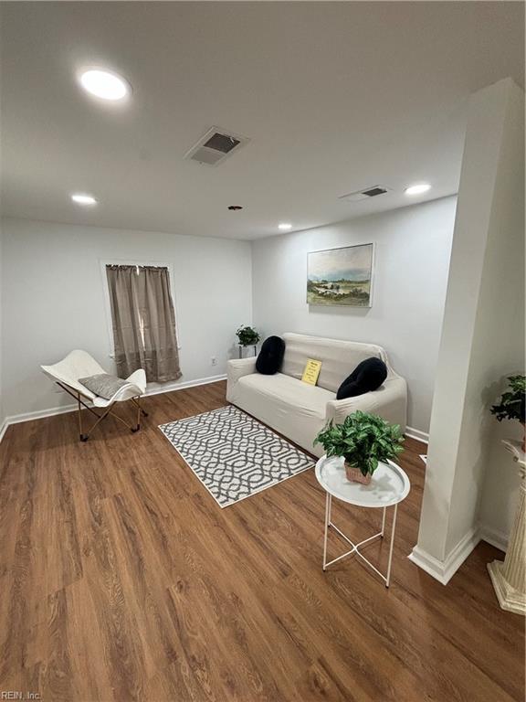 living room with dark hardwood / wood-style floors