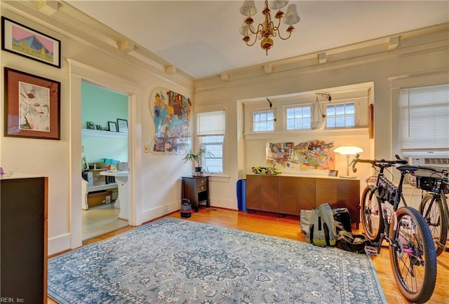 interior space with an inviting chandelier and light wood-type flooring