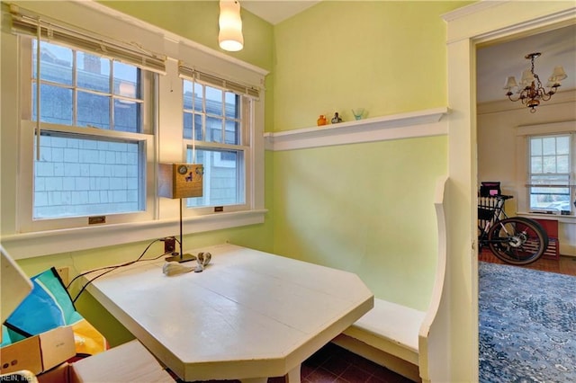 dining area featuring a notable chandelier