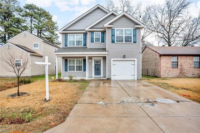 view of front of home with a garage and a front yard