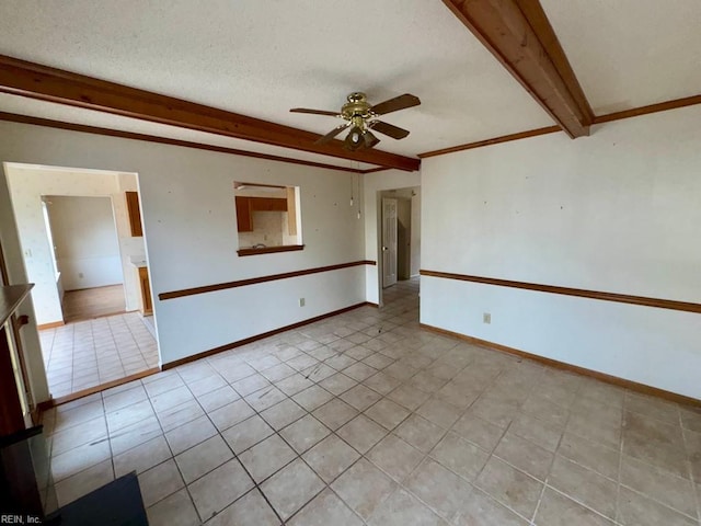 tiled empty room featuring ceiling fan, ornamental molding, a textured ceiling, and beam ceiling