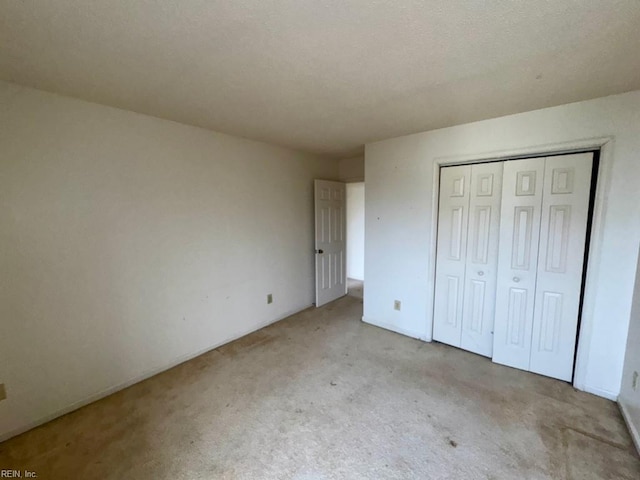 unfurnished bedroom with a closet