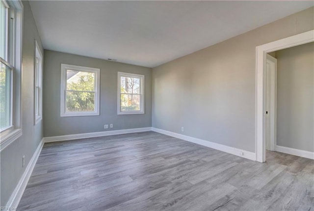 unfurnished room featuring light wood-type flooring