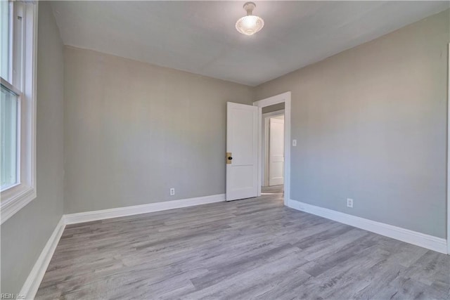 unfurnished room featuring light wood-type flooring