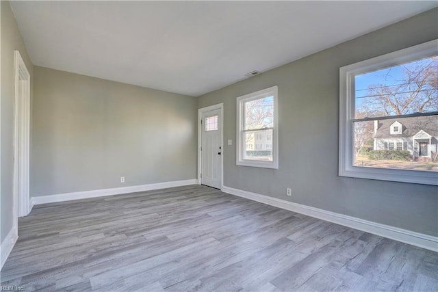 entryway with light hardwood / wood-style flooring