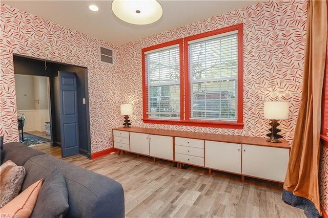 sitting room featuring light hardwood / wood-style flooring