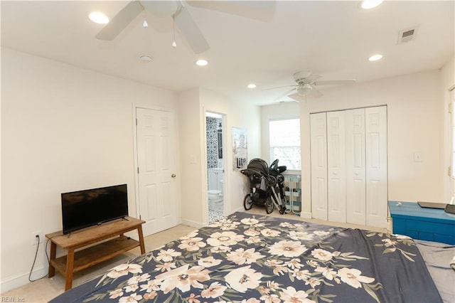 bedroom featuring ceiling fan, ensuite bathroom, and a closet