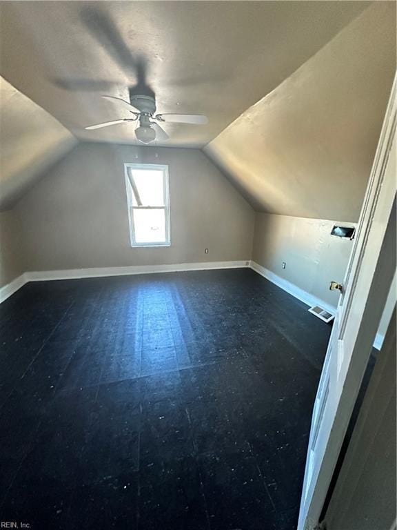 additional living space featuring vaulted ceiling and ceiling fan