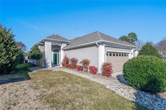 single story home featuring a garage and a front yard