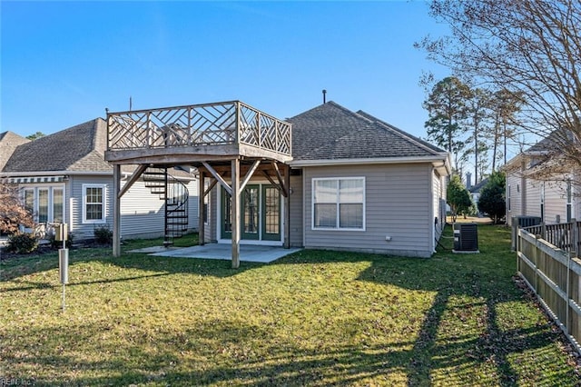 back of property featuring a patio, a deck, a yard, and central AC unit