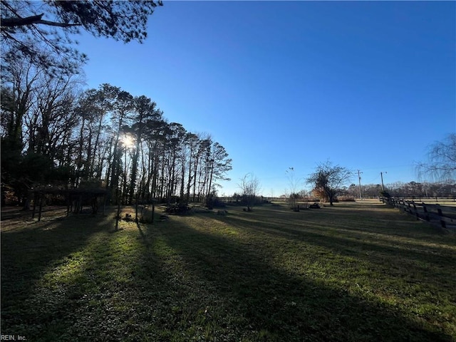 view of yard with a rural view