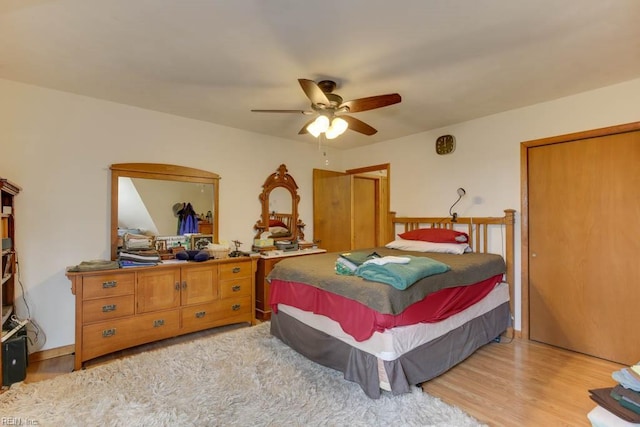 bedroom with light hardwood / wood-style flooring and ceiling fan