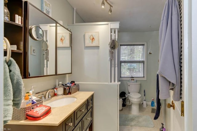 bathroom featuring vanity and toilet