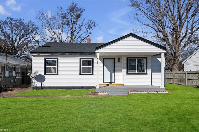 bungalow-style house with a front yard