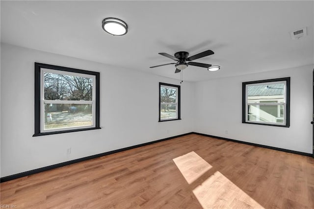 spare room with ceiling fan and light hardwood / wood-style flooring