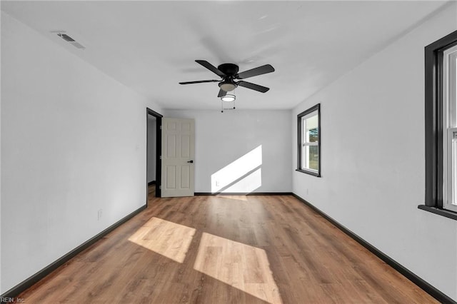 unfurnished room featuring ceiling fan and light hardwood / wood-style floors