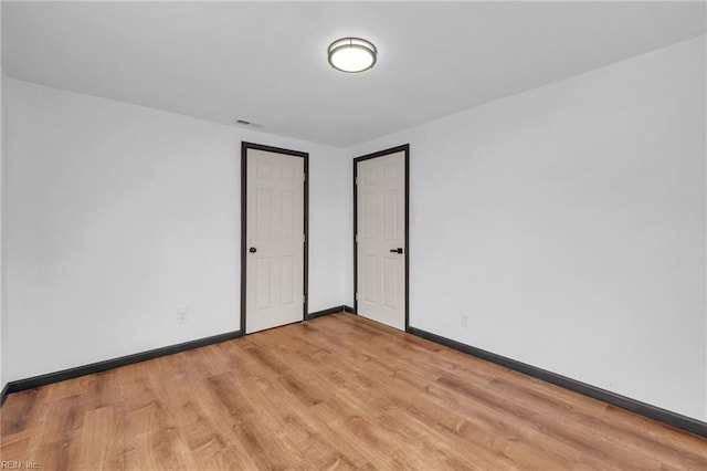 unfurnished bedroom featuring light hardwood / wood-style flooring