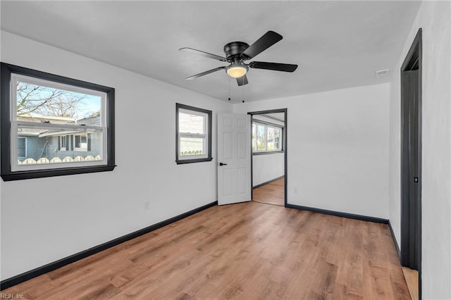 unfurnished bedroom with light hardwood / wood-style floors and ceiling fan