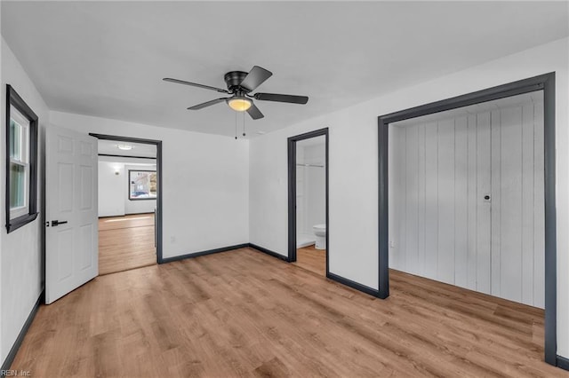 unfurnished bedroom with connected bathroom, ceiling fan, and light wood-type flooring