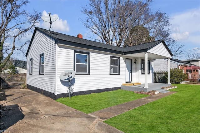 view of front of house featuring a front yard and covered porch